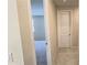 Bright hallway with doors to bedrooms and other rooms at 6554 Rover Way, St Cloud, FL 34771
