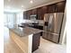 Modern kitchen with stainless steel appliances and granite countertops at 6554 Rover Way, St Cloud, FL 34771
