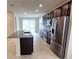 Modern kitchen with stainless steel appliances and granite countertops at 6554 Rover Way, St Cloud, FL 34771