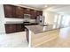 Modern kitchen with stainless steel appliances and granite countertops at 6554 Rover Way, St Cloud, FL 34771