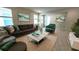 Bright living room featuring a comfortable sofa and stylish decor at 6554 Rover Way, St Cloud, FL 34771