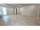 Open living room with tile floors and access to the exterior at 6554 Rover Way, St Cloud, FL 34771