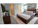Main bedroom with king bed, TV, and walk-in closet at 6554 Rover Way, St Cloud, FL 34771