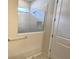 Walk-in shower with glass enclosure and tiled walls at 6554 Rover Way, St Cloud, FL 34771
