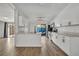 Modern white kitchen with stainless steel appliances and quartz countertops at 67 Sabal Cay Court, New Smyrna Beach, FL 32169