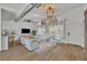 Bright living room features an open floor plan, lots of natural light, and an industrial-style ceiling at 67 Sabal Cay Court, New Smyrna Beach, FL 32169