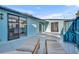 Private patio with lounge chairs and view of kitchen at 67 Sabal Cay Court, New Smyrna Beach, FL 32169