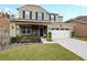 Two-story house with a two-car garage and landscaped front yard at 7043 Oxbow Rd, Minneola, FL 34715