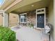 Inviting front porch with stone accents and seating at 7043 Oxbow Rd, Minneola, FL 34715