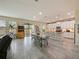 Open kitchen with large island, white cabinets and stainless steel appliances at 7043 Oxbow Rd, Minneola, FL 34715