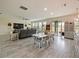Spacious living room with large windows and a view to the backyard at 7043 Oxbow Rd, Minneola, FL 34715