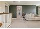 Loft area with a couch and a view down the hallway at 7043 Oxbow Rd, Minneola, FL 34715