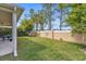 Spacious backyard with grassy lawn and privacy fence at 8060 Bowery Dr, Winter Garden, FL 34787