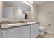 Bathroom with double sinks, granite countertops, and a shower/tub combo at 8060 Bowery Dr, Winter Garden, FL 34787