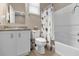Bathroom with shower/tub combo, toilet and granite vanity at 8060 Bowery Dr, Winter Garden, FL 34787