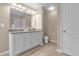 Double vanity bathroom with granite countertop at 8060 Bowery Dr, Winter Garden, FL 34787