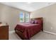 Well-lit bedroom with a double bed and window at 8060 Bowery Dr, Winter Garden, FL 34787