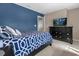Bedroom with a double bed, dresser, and a TV at 8060 Bowery Dr, Winter Garden, FL 34787