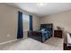 Bedroom with a full-sized bed, dresser and blue curtains at 8060 Bowery Dr, Winter Garden, FL 34787