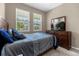 Well-lit bedroom with a double bed and built-in dresser at 8060 Bowery Dr, Winter Garden, FL 34787