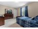 Bedroom with a twin-sized bed, dresser and TV at 8060 Bowery Dr, Winter Garden, FL 34787