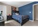 Bedroom with a double bed, nightstand and blue walls at 8060 Bowery Dr, Winter Garden, FL 34787