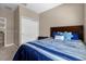 Bedroom with double bed, dresser, and sliding door closet at 8060 Bowery Dr, Winter Garden, FL 34787