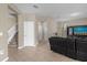 Bright and spacious entryway with staircase and views to living room at 8060 Bowery Dr, Winter Garden, FL 34787