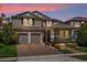 Two-story house with a two-car garage and landscaped front yard at 8060 Bowery Dr, Winter Garden, FL 34787