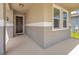 Front porch entryway with dark brown door and sidelights at 8060 Bowery Dr, Winter Garden, FL 34787