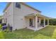 House exterior with covered patio and AC unit at 8060 Bowery Dr, Winter Garden, FL 34787