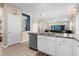 Island kitchen with granite countertops, stainless steel appliances and open layout at 8060 Bowery Dr, Winter Garden, FL 34787