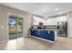 Kitchen features granite countertops, stainless steel appliances, and view of backyard at 8060 Bowery Dr, Winter Garden, FL 34787