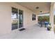 Covered patio with table and chairs, overlooking backyard at 8060 Bowery Dr, Winter Garden, FL 34787