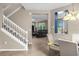 White staircase with a view into the living area at 8060 Bowery Dr, Winter Garden, FL 34787