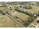 Wide aerial view showcasing a house on a large lot with surrounding farmlands at 851 Marllo Rd, Kissimmee, FL 34744