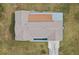 Overhead view of a house showing roofline, a back patio, and driveway at 851 Marllo Rd, Kissimmee, FL 34744