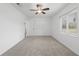 Spacious bedroom with neutral carpeting and ceiling fan at 851 Marllo Rd, Kissimmee, FL 34744