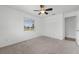 Spacious bedroom with neutral decor and ceiling fan at 851 Marllo Rd, Kissimmee, FL 34744