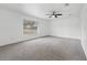 Bright bedroom with neutral carpeting and ceiling fan at 851 Marllo Rd, Kissimmee, FL 34744