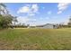 Gray house exterior with large backyard at 851 Marllo Rd, Kissimmee, FL 34744