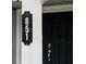 Modern house number sign on a white column next to a dark door at 851 Marllo Rd, Kissimmee, FL 34744