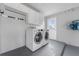 Laundry room with washer, dryer, and cabinets at 851 Marllo Rd, Kissimmee, FL 34744