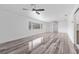 Bright and airy living room with hardwood floors and ceiling fans at 851 Marllo Rd, Kissimmee, FL 34744