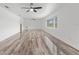 Spacious living room with wood-look flooring and large windows at 851 Marllo Rd, Kissimmee, FL 34744