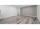 Walk-in pantry with gray cabinets and wood-look flooring at 851 Marllo Rd, Kissimmee, FL 34744