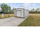 Metal storage shed with roll-up door at 851 Marllo Rd, Kissimmee, FL 34744