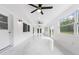 Bright sunroom features tile flooring, multiple ceiling fans, and large windows at 851 Marllo Rd, Kissimmee, FL 34744
