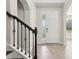 Bright entryway with elegant staircase and wood flooring at 8714 Sonoma Coast Dr, Winter Garden, FL 34787