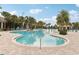 Large freeform pool with plenty of lounge chairs and shade structures at 8714 Sonoma Coast Dr, Winter Garden, FL 34787